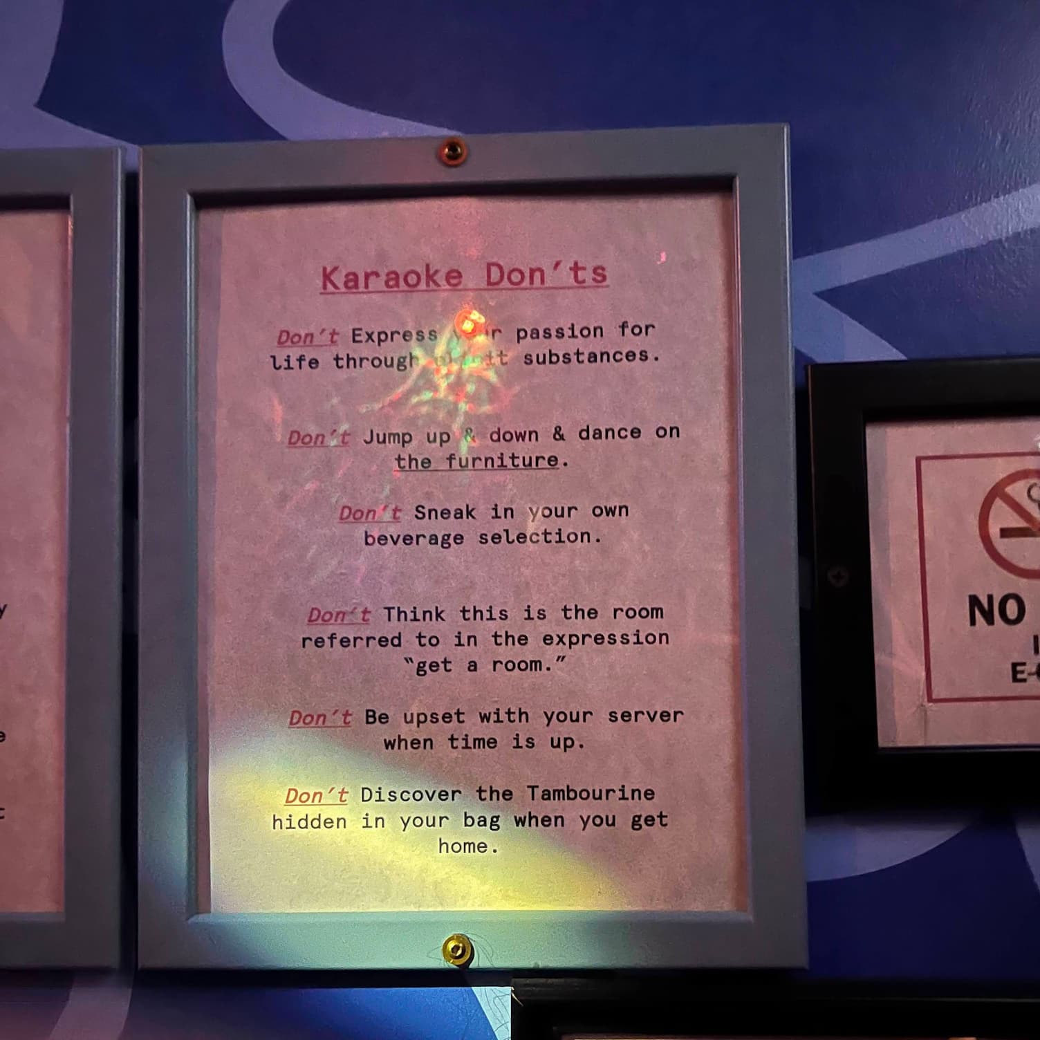 A printed list of karaoke don'ts framed on the wall of Korean BBQ and karaoke spot Insa, in Brooklyn. The last rule reads 'Don't
discover the tambourine hidden in your bag when you get home.'